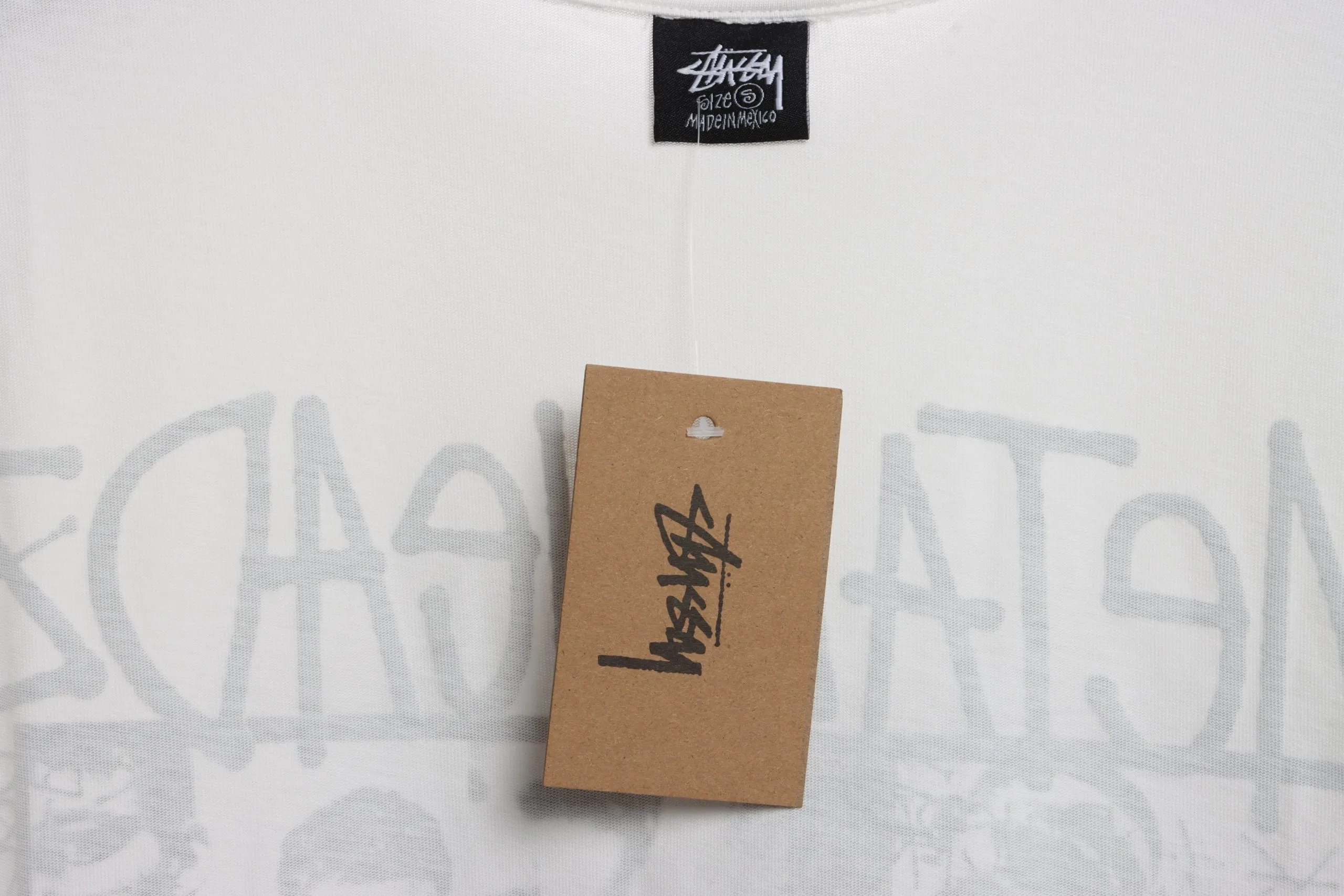 Stussy-Reflective-Character-Print-T-Shirt-12.webp