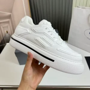 PRADA-MACRO-RE-NYLON-AND-BRUSHED-LEATHER-SNEAKERS-PRD061-1.webp